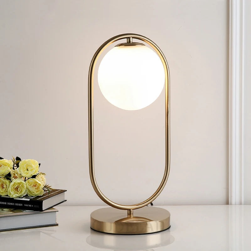 Lampe de chevet boule en verre et métal doré